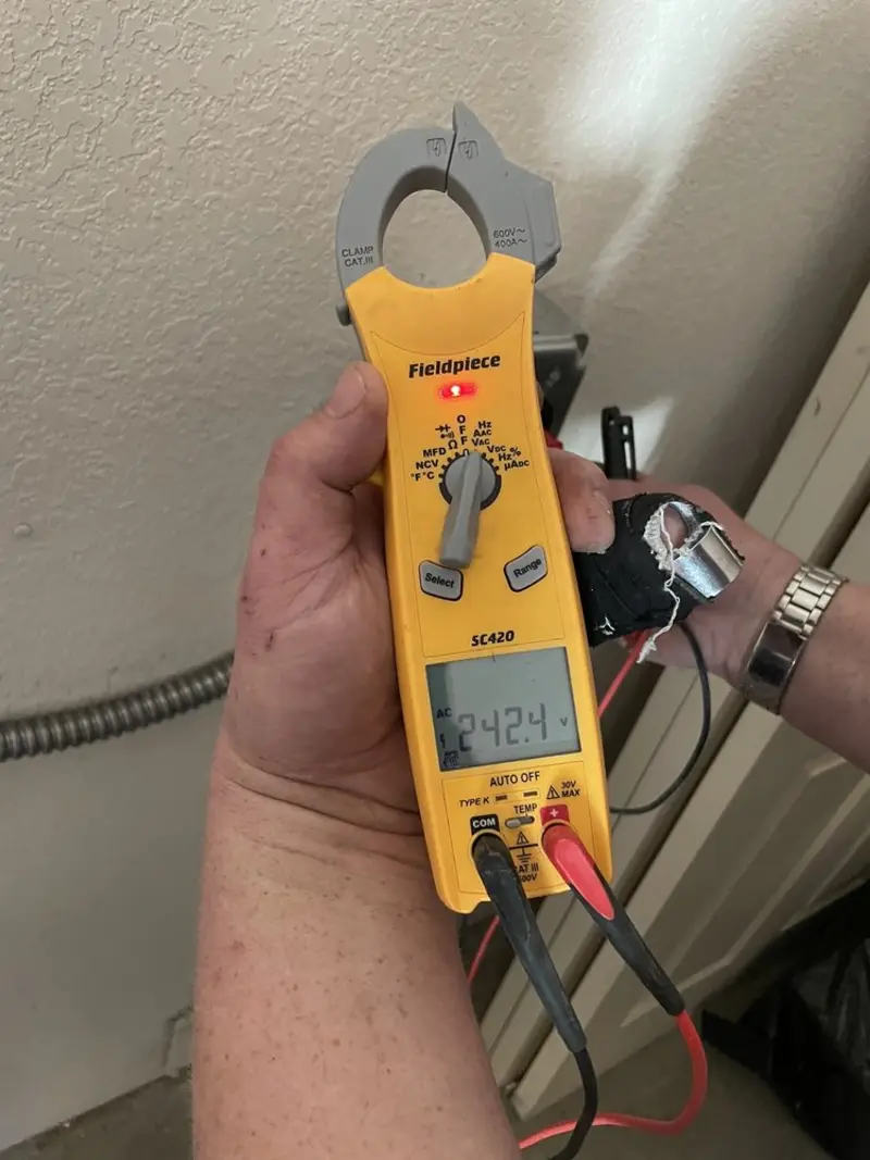 Voltage testing with clamp meter during Whole House Surge Protector in Nyssa